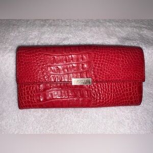 Furla wallet with an alligator-embossed pattern.